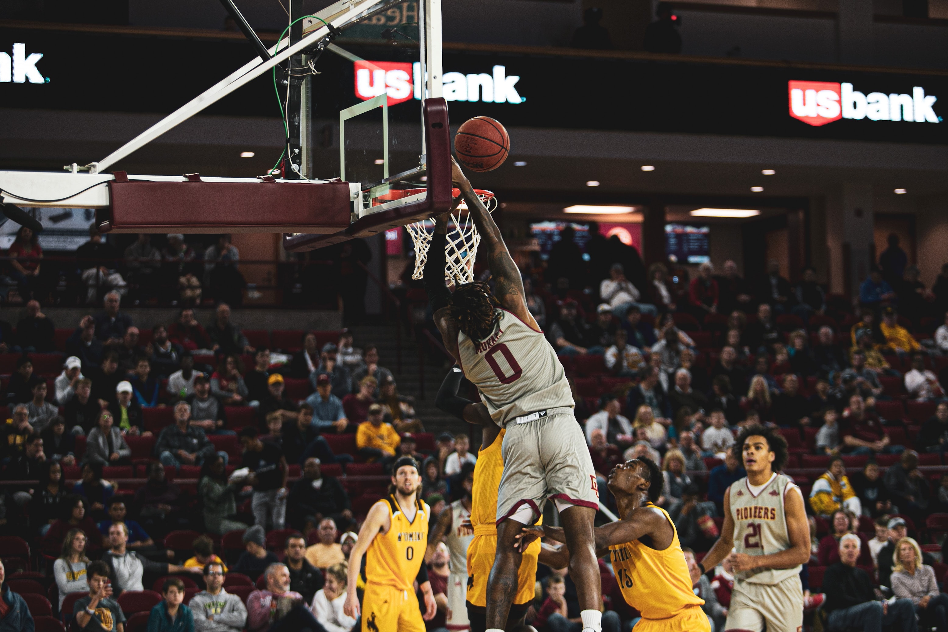 Image of a player dunking a basketball